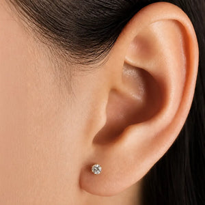 Close-up of an ear wearing Astra 6-prong 3.5mm diamond stud earring.