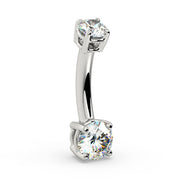 Side profile of 14k white gold diamond belly ring showing curved barbell and prong settings