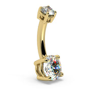 Angled side view of 14k yellow gold diamond navel ring highlighting 4-prong settings on both stones
