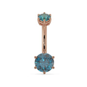 14k rose gold belly ring with dual blue topaz gems in six-prong settings, front view