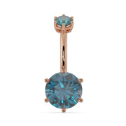 14k rose gold navel ring with 8mm round blue topaz in six-prong setting, front view