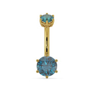 14k yellow gold belly ring with dual blue topaz gems in six-prong settings, front view