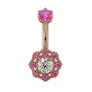 14k rose gold Celtic belly ring with pink sapphire top stone and diamond center in filigree flower dangle