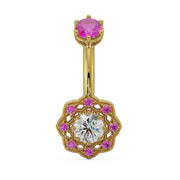 14k yellow gold Celtic navel ring with pink sapphire top stone and diamond center in filigree floral charm