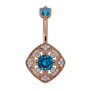 14k rose gold Fleur de Chance belly ring with blue diamond and CZ halo filigree charm, front view