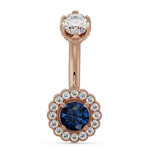 14k rose gold belly ring with blue sapphire center and diamond halo floral setting, front view