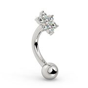Side profile of 14k white gold flower curved barbell showing CZ cluster and curved shaft angle