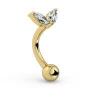 Angled side view of 14k yellow gold petals curved barbell showing CZ setting and curve