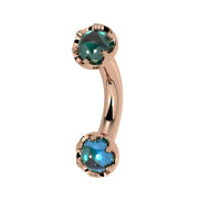 Reina London Blue Topaz Crown Curved Barbell in 14k rose gold, side view - for navel, rook, or eyebrow piercings