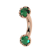 Reina Zambian Emerald Crown Curved Barbell in 14k rose gold, side view - for navel, rook, or eyebrow piercings