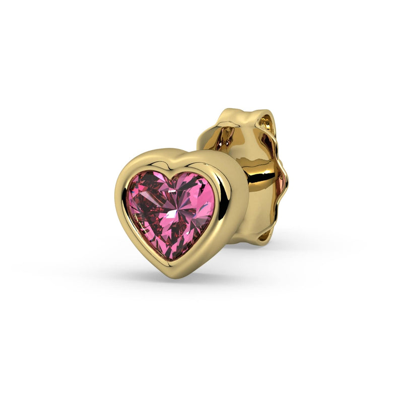 Single 14k yellow gold pink sapphire heart stud earring, angled view with vivid pink bezel-set stone