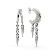 14K white gold Vera diamond cuff earring pair displayed together with pavé hoops and bezel-set spike drops
