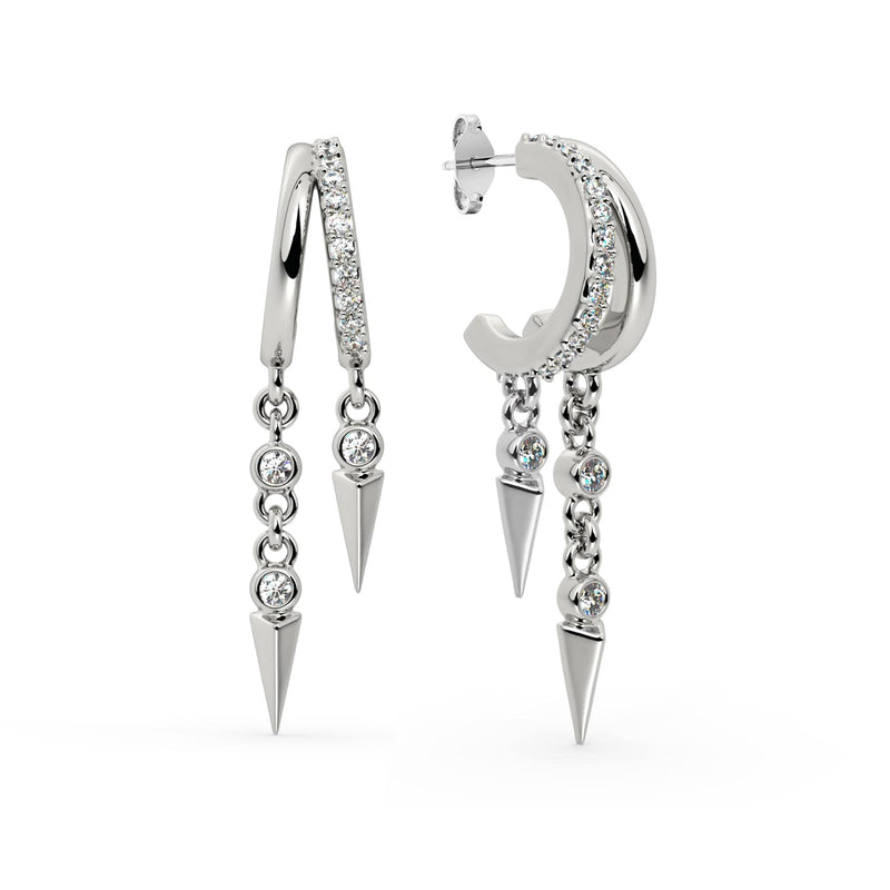 14K white gold Vera diamond cuff earring pair displayed together with pavé hoops and bezel-set spike drops