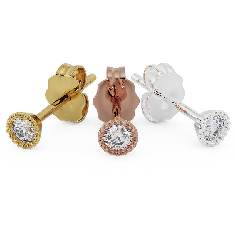 Angled side view of 14K yellow, rose, and white gold milgrain stud earrings showing post and butterfly back