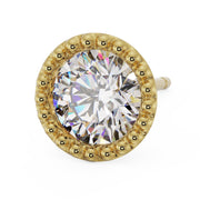 Angled top view of 14K yellow gold milgrain stud with CZ, showing bead halo and post against white background