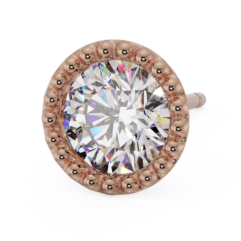 Close-up front-angled view of 14K rose gold milgrain stud earring, beaded border and post visible from above