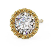 Close-up angled view of 14K yellow gold milgrain stud earring with large CZ and prominent beaded setting