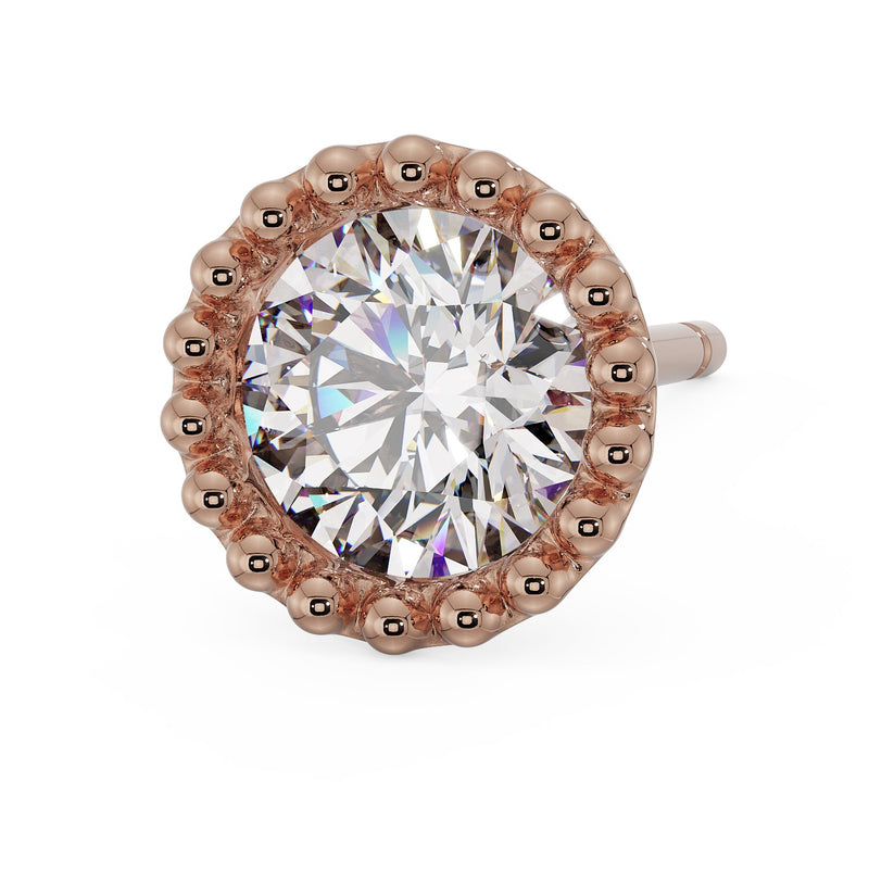 Close overhead view of 14K rose gold milgrain stud with large CZ stone and bold rose gold bead surround