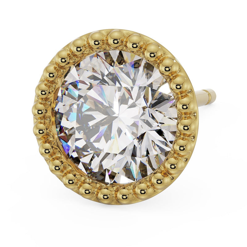 Top-angled view of 14K yellow gold milgrain stud earring with large CZ and clearly defined beaded gold rim