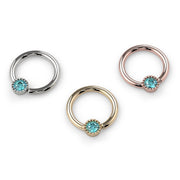 All three metal options of the aqua diamond Perlagé fixed bead ring displayed together at larger size for comparison