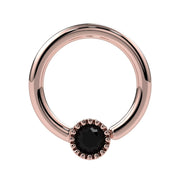 14k rose gold Perlagé fixed bead ring with black diamond, slightly angled front view showing milgrain bead detail
