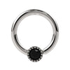14k white gold black diamond Perlagé fixed bead ring, slightly angled front view emphasizing milgrain bezel contrast