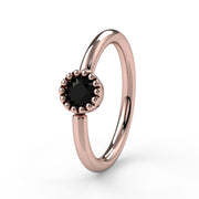 14k rose gold black diamond Perlagé captive bead ring with beaded milgrain bezel, angled front view