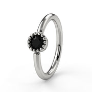 14k white gold black diamond Perlagé fixed bead ring with milgrain bezel setting, angled front view