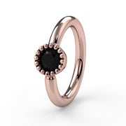 14k rose gold black diamond Perlagé fixed bead ring showing larger milgrain bezel setting, front angle