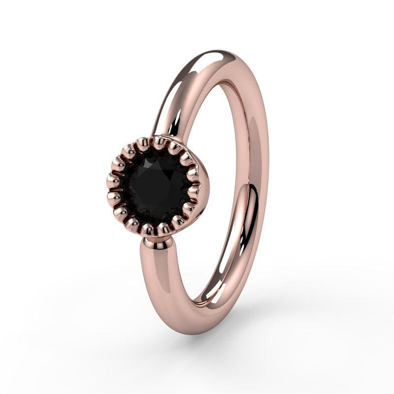 14k rose gold black diamond Perlagé fixed bead ring showing larger milgrain bezel setting, front angle