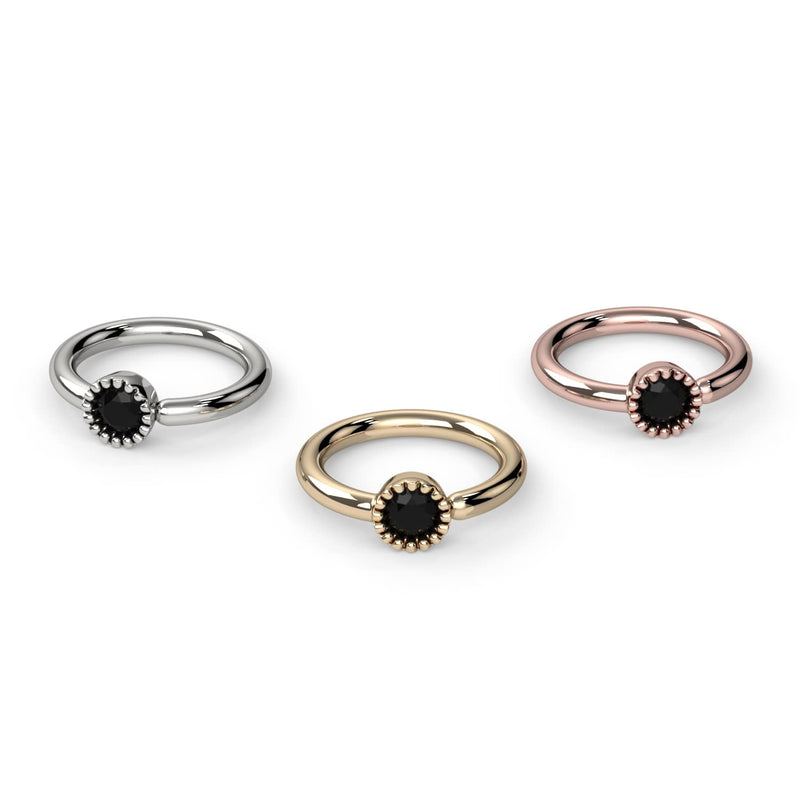 Front-facing comparison of black diamond Perlagé captive bead ring in white gold, yellow gold, and rose gold