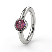Close-up of 14k white gold pink diamond Perlagé ring highlighting the milgrain bezel detail