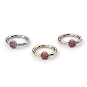 Front-facing comparison of pink diamond Perlagé captive rings in white, yellow, and rose gold