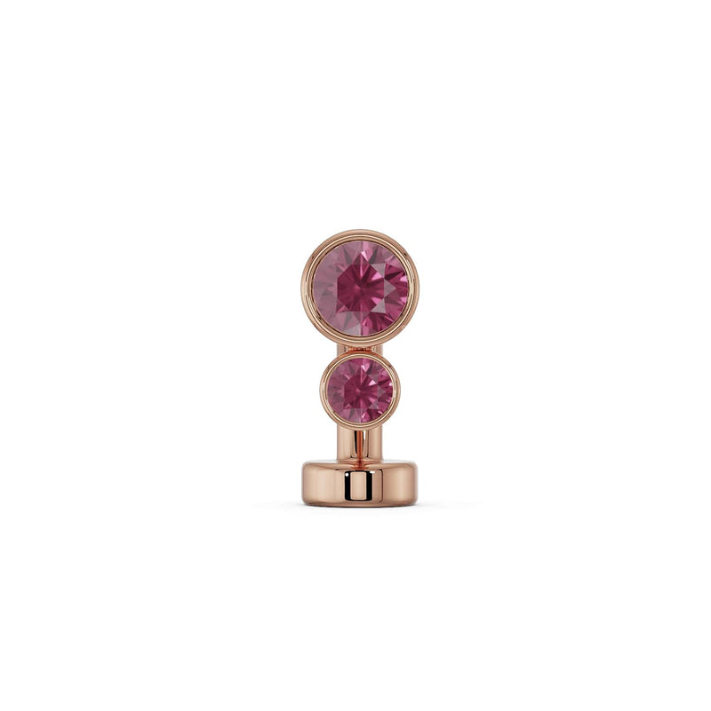 14k rose gold floating navel ring with two bezel-set deep pink garnet-colored gemstones, front view