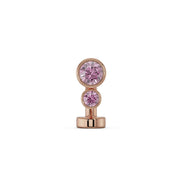 14k rose gold floating belly ring with two bezel-set pink sapphire gemstones, front view