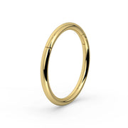 18K yellow gold plain clicker ring hoop, angled three-quarter view showing clicker closure detail