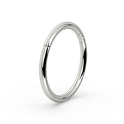 18K white gold plain clicker ring hoop, angled three-quarter view showing high-polish finish