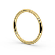 18K yellow gold seam ring hoop, angled view revealing rounded band profile and high-polish finish