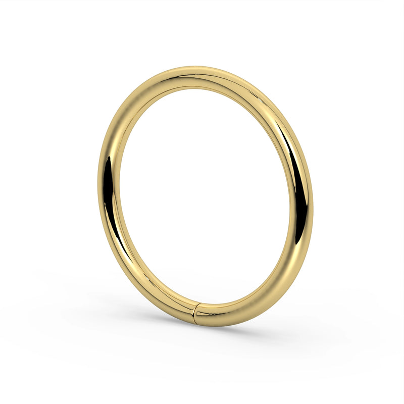 18K yellow gold seam ring hoop, angled view revealing rounded band profile and high-polish finish