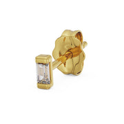 Side profile of 14K yellow gold baguette diamond stud showing bezel setting and butterfly back