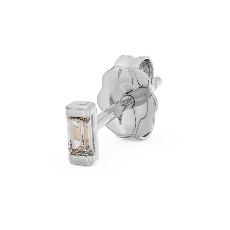 14K white gold baguette diamond stud earring angled view with butterfly back and step-cut diamond