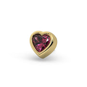 Close-up front view of 14k yellow gold heart bezel stud showing rhodolite garnet facets and setting detail