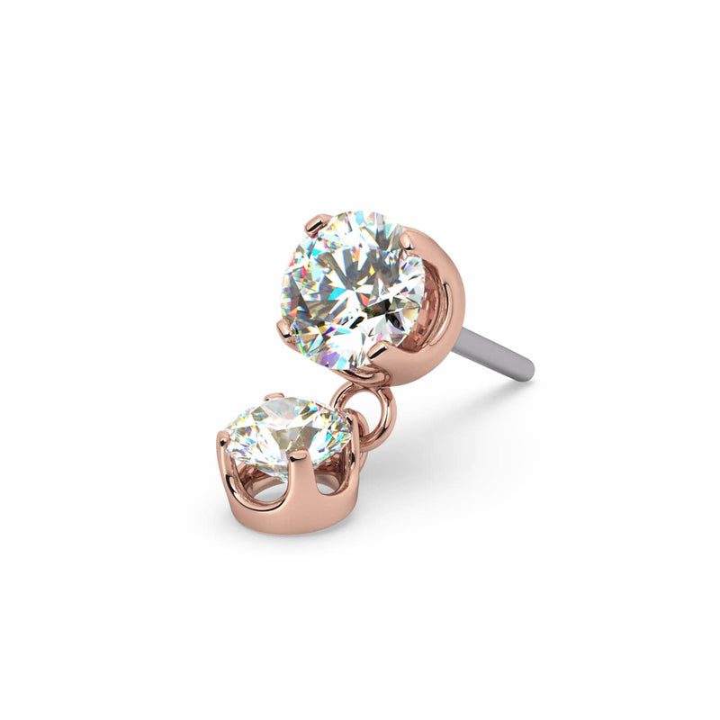 Close-up of 14k rose gold pushpin diamond dangle end showing prong settings and angled titanium pin