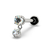 Angled view of 14k white gold prong diamond dangle flat back labret with dual sparkling round stones