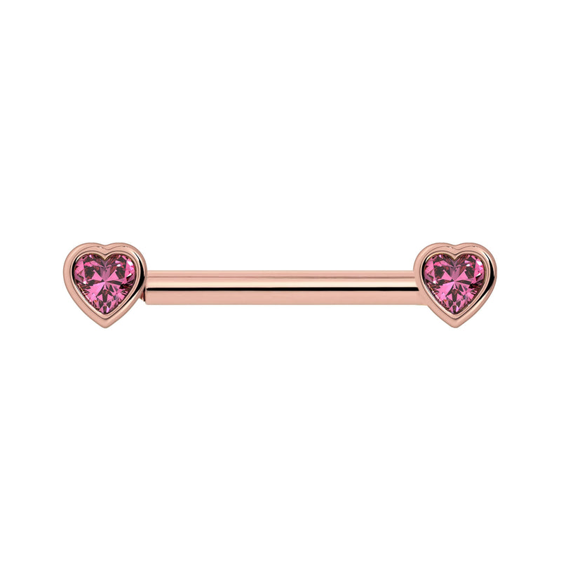 14k rose gold nipple barbell with heart-shaped pink sapphire bezel ends, front view