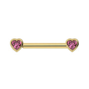 14k yellow gold nipple barbell with bezel-set heart-shaped pink sapphire ends, front view