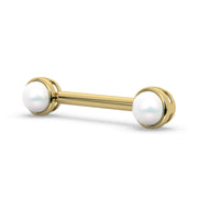 14K yellow gold Akoya pearl nipple barbell, angled view showing bezel-set pearl ends