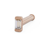 14K rose gold baguette diamond nose bone style, angled view showing ball end and step-cut diamond