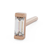 14K rose gold baguette diamond nose stud bone style, angled view of bezel-set diamond with straight post
