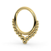 Side profile of 14k yellow gold Bali seam ring showing beaded arch detail and seamless closure